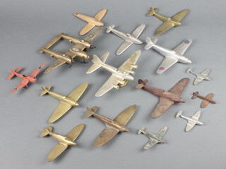Three brass models of Spitfires 13cm, an aluminium model of a Hurricane and other model aircraft 