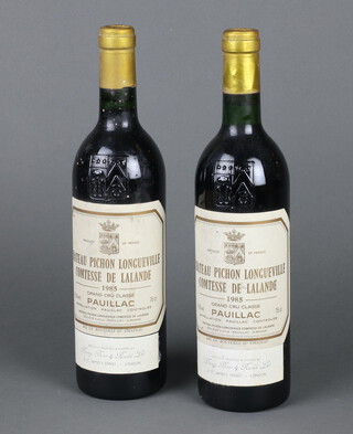 Two bottles of 1985 Chateau Pichon Longueville Comtesse de Lalande Grand Cru Pauillac red wine supplied by Berry Brothers and Rudd 