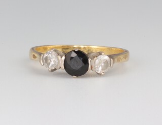 A yellow metal 18ct sapphire and diamond ring, the sapphire 0.5ct, the diamonds each 0.25ct, size M, 3.2 grams 