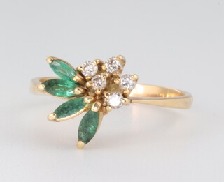 A yellow metal emerald and diamond floral ring 2.9 grams, size N 