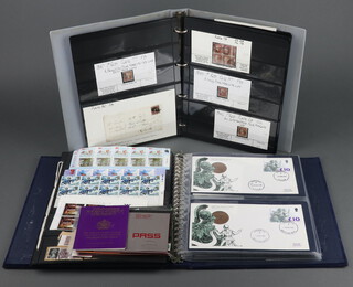 A collection of penny red stamps contained in a blue ring bound album together with an album of Elizabeth II GB mint stamps, a collection of Elizabeth II ten pound first day covers including House of Commons and House of Lords post marks  