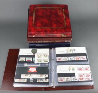 A collection of approx. 162 GB Elizabeth II presentation stamps contained in 3 albums, together with an album of GB first day covers 