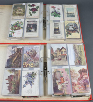An albums of approx. 260 greeting cards and an album of approx. 252 black and white and coloured postcards 