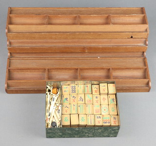 A Mahjong set comprising 143 bamboo tiles, approx. 117 bone counting sticks and 4 walls 