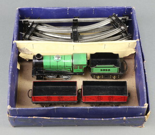 A Hornby O gauge clockwork locomotive tender, 2 trucks, quantity of rolling stock 
