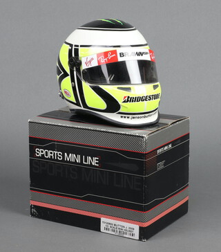 Jensen Button, a half scale Formula 1 mini helmet for Team Brawn 2009, signed by Jensen Button, boxed 