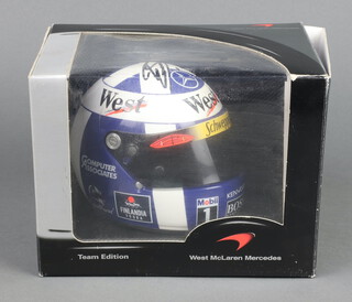 David Coulthard, a half scale Formula 1 helmet for Mclaren Mercedes, signed by David Coulthard, boxed 