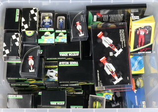 The Ayrton Senna Racing Car Collection by Lang, a collection of 1:8 scale helmets (18), Mini Champs 1:43 scale racing cars (30), a 1:43 scale Lotus Renault 97T and a 1:43 scale McLaren MP 44/8Ford, 2 figures of Senna in Williams 1994 outfit, framed certificate and booklet together with other Mini Champs scale Formula One models, all boxed 