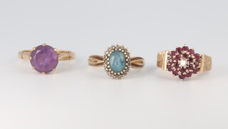 A 9ct yellow gold amethyst ring, a ditto topaz ring and a garnet ring, sizes N, N 1/2 and O 1/2, 11.3 grams 