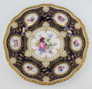 A Victorian Royal Worcester cabinet plate with blue and gilt ground decorated with panels of spring flowers by E Phillips 25.5cm 