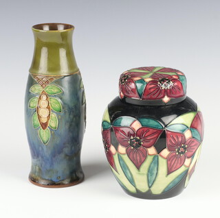 A modern Moorcroft baluster vase and cover decorated the trillium flower pattern dated 2000 together with a Royal Doulton vase decorated with stylised leaves X8851/1802 20cm 