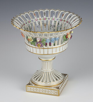 A modern German porcelain pierced centrepiece with applied floral decoration, raised on a square base 21cm 