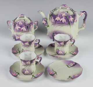 A Continental Art Nouveau tea set decorated with flowers comprising teapot, 3 cups, 4 saucers (1 a/f), a sugar bowl and lid 