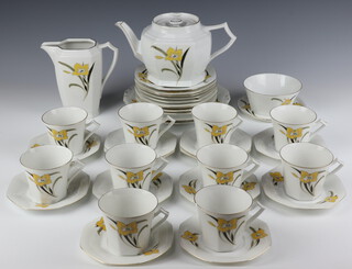 An Art Deco Czechoslovakian tea set decorated with stylised flowers comprising 10 tea cups (3 a/f), 12 saucers, 2 sandwich plates, 9 small plates, teapot (chip to spout), milk jug, sugar bowl and stand 