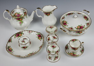 A Royal Albert Old Country Roses tea, coffee and dinner service comprising 2 large tea cups and 2 medium tea cups (all seconds), 6 coffee cups, 6 saucers, tea pot, milk jug (second), cream jug, sugar bowl, 6 tea saucers, 9 large tea saucers (6 seconds), 5 small plates (1 second), 8 side plates (3 seconds), 10 dinner plates (5 seconds), 9 dessert bowls (1 second), oval meat plate, 1 oval bowl, 2 oval dishes (1 second), 4 serving plates (3 seconds), saucer, dish, box, bell, vase, floral display, preserve pot (second) and lid (a/f), 3 candlesticks (1 second) and a telephone  