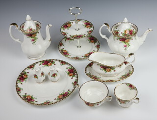 A Royal Albert Old Country Roses extensive part tea, coffee and dinner service, comprising 6 coffee cups, 6 saucers, 6 tea cups, 6 saucers, 6 soup bowls, 6 saucers (all seconds), coffee pot, tea pot, cake stand (second), milk jug, cream jug, sugar bowl, 12 small plates, 6 side plates, 6 dinner plates, serving plate, meat plate, slop bowl, tureen and cover, 6 dessert bowls (5 seconds), sauce boat and stand, salt and pepper and cake knife 