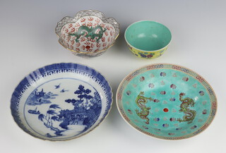 An 18th Century Chinese blue and white shallow dish 21cm, a yellow ground tea bowl 11cm, a scalloped dragon bowl 15cm and a turquoise ditto 20cm 
