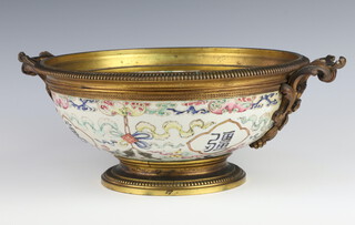 An early 19th Century Chinese famille rose bowl decorated with bats, scrolls, fish and characters, now with a gilt metal base and mount with red Jaiqing seal mark (1796-1820) to base 28cm. the interior decorated with peaches 