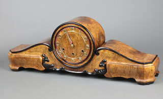 An Art Deco chiming mantel clock with gilt Arabic numerals, contained in a figured walnut Admiral's hat style case, with key,  25cm h x 70cm w x 15cm  