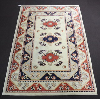 A Caucasian style white and blue ground machine made rug with 3 diamonds to the centre within a multi row border 304cm x 202cm 
