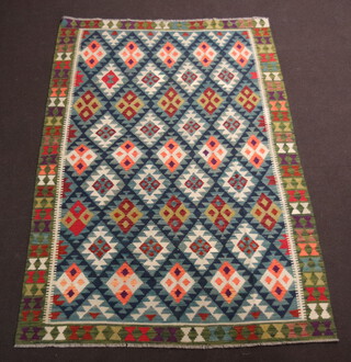 A white, green and orange ground Maimana Kilim rug with all over diamond design 240cm x 157cm 