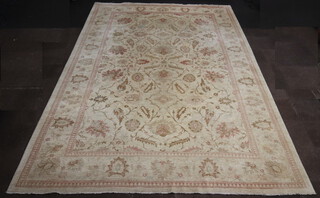 A Caucasian style cream ground floral patterned carpet 537cm x 369cm  