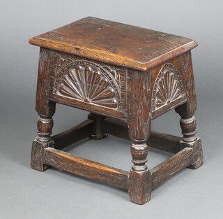 A Victorian rectangular carved oak stool with hinged lid and arcaded decoration, raised on turned and block supports 44cm h x 58cm w x 28cm d  