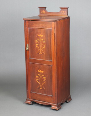 An Edwardian Art Nouveau inlaid mahogany music cabinet with raised shaped back, fitted shelves enclosed by panelled doors, raised on bracket feet 125cm h x 48cm w x 37cm d 