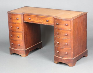 A Victorian mahogany dressing table with inset surface above 1 long and 8 short drawers with turned handles, 73cm h x 120cm w x 53cm d (in one section) 