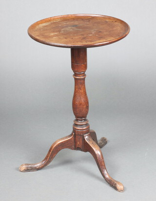 A 19th Century mahogany circular dish top wine table raised on a turned and tripod base 72cm h x 47cm diam. 