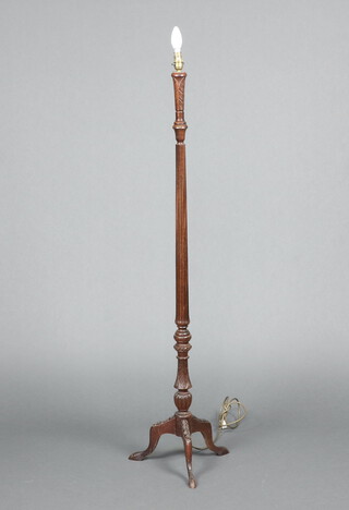 A 19th Century style turned and reeded mahogany standard lamp raised on tripod base 133cm h 