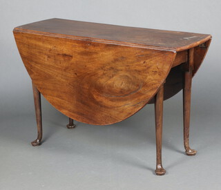 A Georgian oval mahogany drop flap dining table raised on pad feet 73cm h x 115cm  x 38cm 