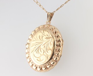 A 9ct yellow gold oval locket and a ditto 60cm chain, 11.3 grams gross, 