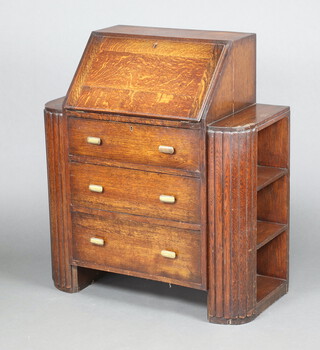 An Art Deco student's oak bureau, the fall front revealing a well fitted interior above 3 long graduated drawers, the sides fitted 3 shelves, 102cm h x 89cm w x 41cm d 