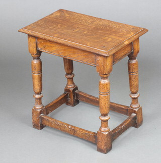 A 1920's rectangular oak joined stool raised on turned and block supports with box frame stretcher 50cm x 51cm x 30cm 