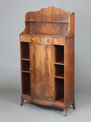 A Georgian style mahogany bow front bookcase with raised back fitted a shelf and recess above 1 long and 2 short drawers with cupboard below flanked by a pair of open bookcases, raised on bracket feet 144cm h x 74cm w x 29cm d 