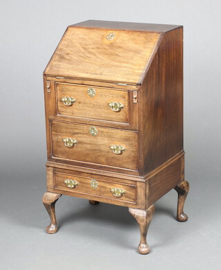 A Georgian style mahogany bureau, the fall front revealing a well fitted interior with pigeon holes and drawers above 3 long drawers, raised on bracket feet 92cm h x 49cm w x 41cm d 