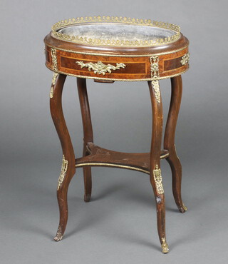 A 19th/20th Century oval inlaid mahogany jardiniere with zinc metal liner and gilt gallery, raised on cabriole supports with shaped undertier and with gilt metal mounts throughout 81cm h x 57cm w x 39cm d 