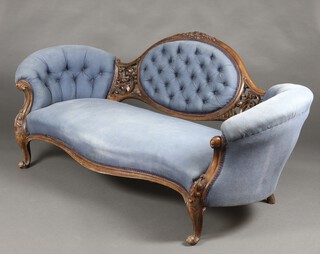 A Victorian carved mahogany show frame sofa upholstered in blue buttoned material, raised on  cabriole supports 81cm h x 184cm w x 60cm d (seat 113cm x 40cmd) 