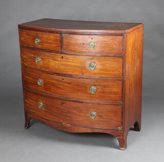 A Georgian crossbanded and inlaid mahogany bow front chest of 2 short and 3 long drawers with replacement ring drop handles, raised on splayed bracket feet, 105cm h x 106cm w x 55cm d 