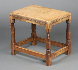 Robert "Mouseman" Thompson of Kilburn, a rectangular oak stool/occasional table with castellated decoration,  raised on turned and block supports, two of the turned supports carved a mouse 46cm h x 50cm w x 37cm d 