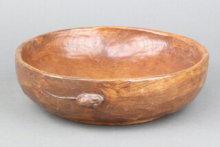 Robert "Mouseman" Thompson of Kilburn, a circular turned oak fruit bowl with adzed decoration and mouse to side 7cm h x 23cm diam. 