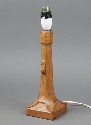 Robert "Mouseman" Thompson of Kilburn, a carved oak table lamp raised on a turned column with square base, having a carved mouse to the centre of the column, 25cm h x 9cm w x 9cm d 