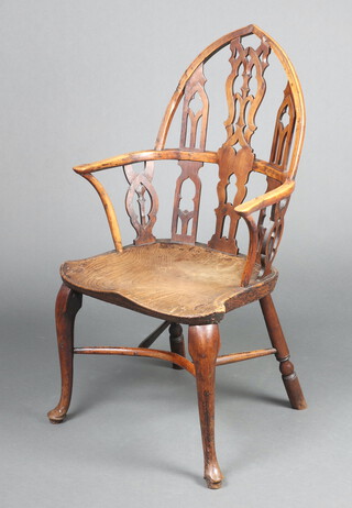 An 18th Century elm and yew Gothic Windsor elbow chair with solid elm seat, raised on cabriole supports with crinoline stretcher, possibly Thames Valley, circa 1760, 107cm h x 55cm w x 45cm d (seat 33cm x 32cm) 
