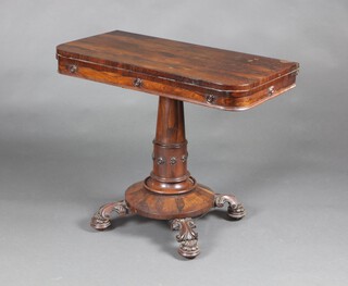 A William IV rosewood D shaped card table raised on a turned column and circular base with 4 panel supports 75cm h x 91cm w x 45cm d 