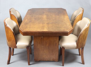 In the manner of Epstein, an Art Deco 'cloud' walnut dining suite in the manner of Epstein comprising lozenge shaped 3/4 galleried dining table, raised on squared  column supports 76cm h x 163cm l x 92cm w together with a set of 4 cloud back dining chairs upholstered in light brown leather raised on square tapered supports 83cm h x 51cm w x 43cm d (seats 25cm x 29cm) 