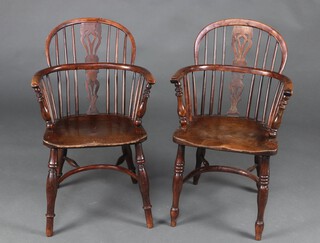 A near pair of 19th Century Nottinghamshire yew and elm low and vase slat back Windsor chairs, one chair with 3 ring turns to the front support 91cm h x 48cm w x 40cm d (seat 31cm x 25cm), the other having 1 ring turn 88cm x 47cm x 38cm (seat 34cm x 28cm)