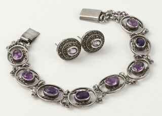 An amethyst set silver bracelet and a pair of ditto ear studs 