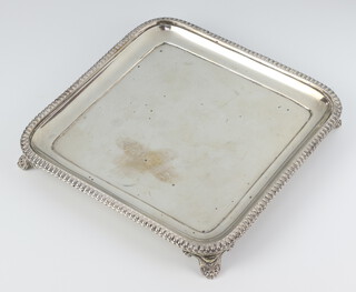 A Victorian silver square salver on scroll feet Birmingham 1865, 499 grams, 20.5cm 