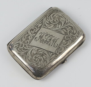 A silver engraved cigarette case with monogram, Birmingham 1915, 68 grams gross 